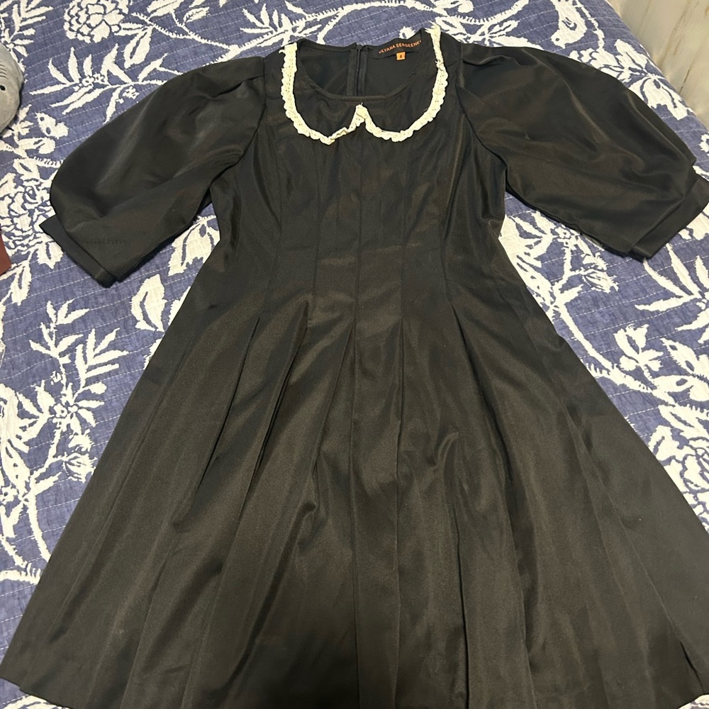 Elegant Black Dress with White Trim